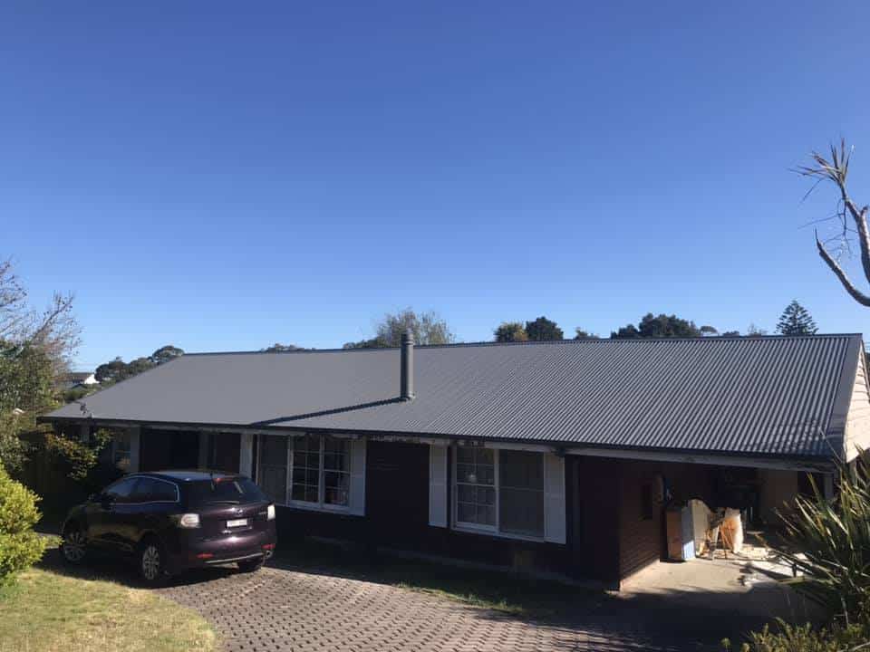 new roof with gutters and downpipes