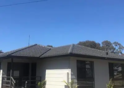 photo of a full roof restoration, the roof is now a woodlands grey tile